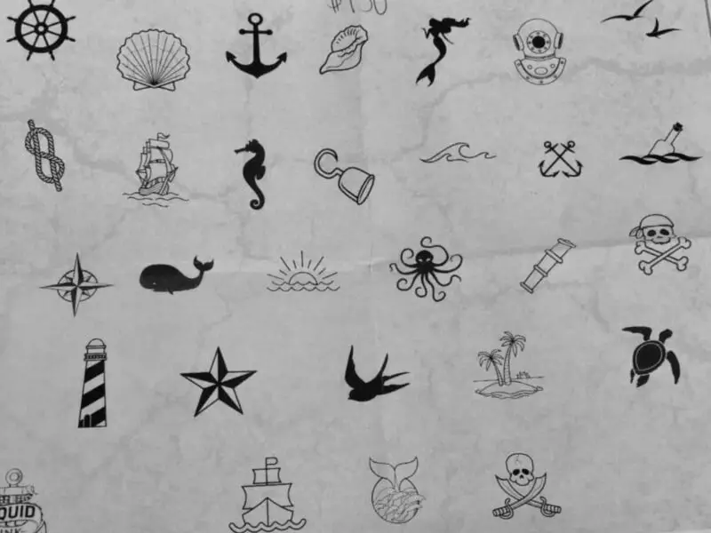 A selection of tattoo flash including anchors, stars, whales
